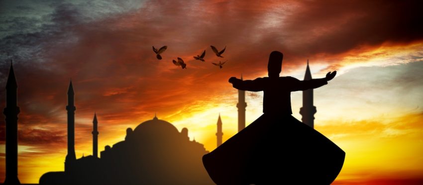 danzatore sufi balla con sullo sfondo il tramonto e una moschea